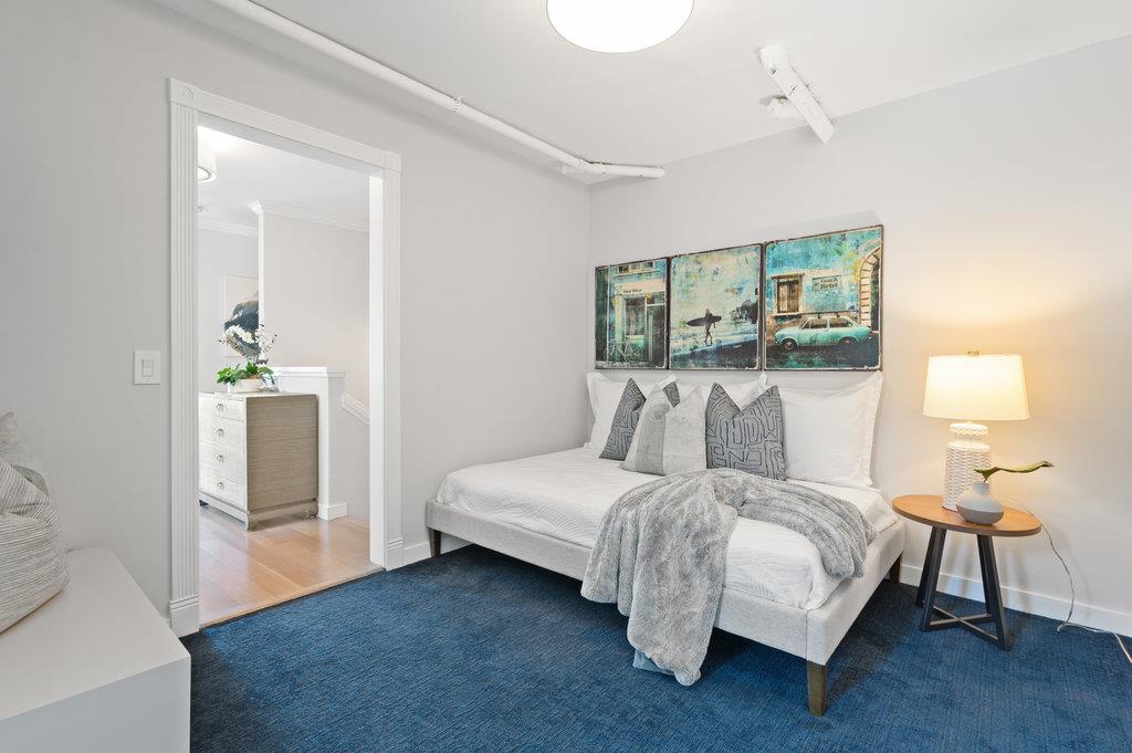 415 Roberts Road Pacifica, CA 94044 - Photo 36 of 69 a bedroom with a bed and a night stand