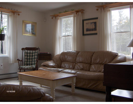 11 Thistle Lane Rochester, MA 02770 - Photo 6 of 11 a living room with furniture rug and window