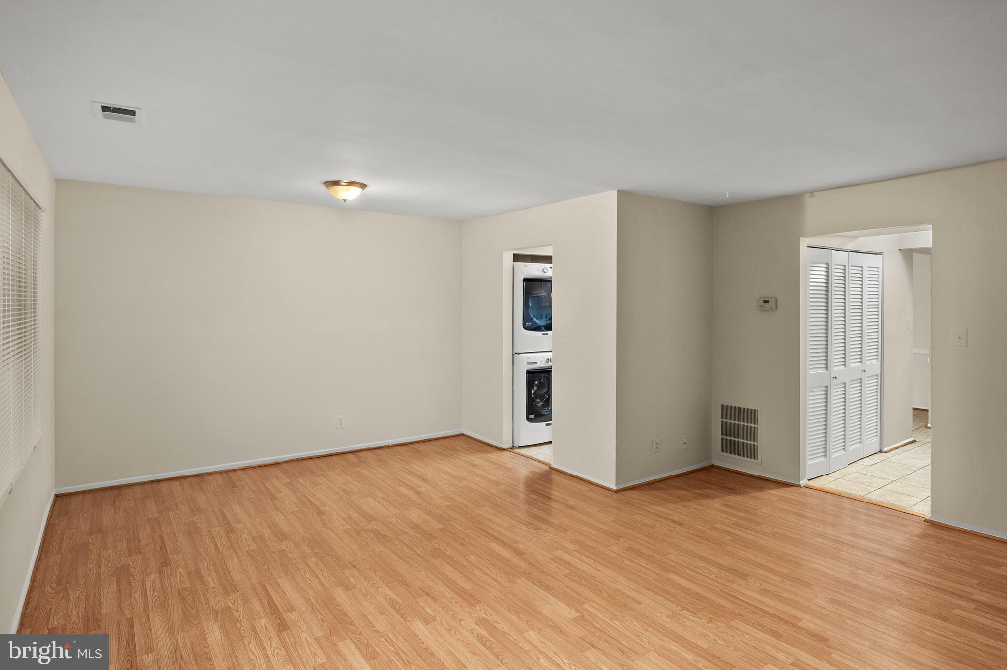 17500 Hoskinson Road Poolesville, MD 20837 - Photo 10 of 32 a view of an empty room with wooden floor and closet