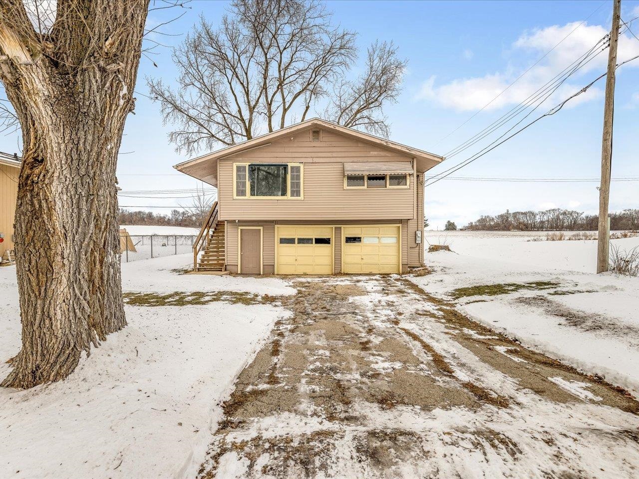 4381 Safford Road Rockford, IL 61101 - Photo 1 of 21 a view of a house with a yard covered in snow