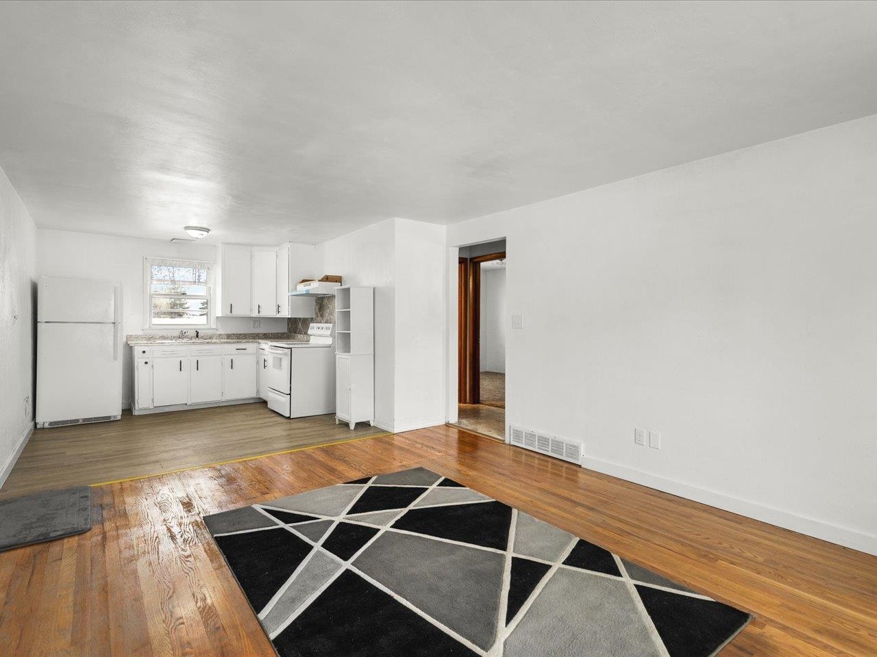 4381 Safford Road Rockford, IL 61101 - Photo 6 of 21 a kitchen with stainless steel appliances granite countertop a stove and a refrigerator