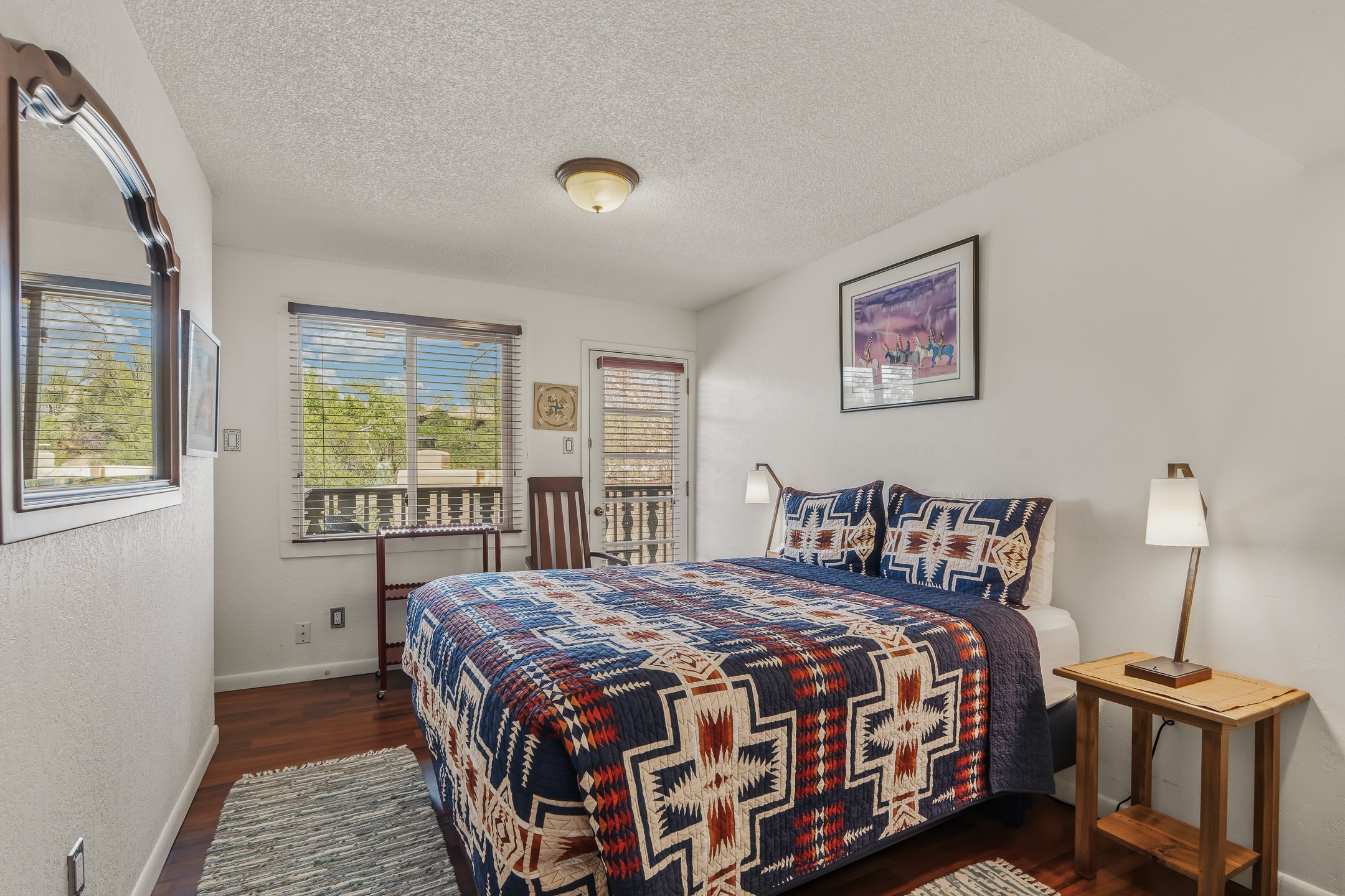 320 Artist Road, Unit 93 Santa Fe, NM 87501 - Photo 18 of 40 Guest bedroom with door to balcony