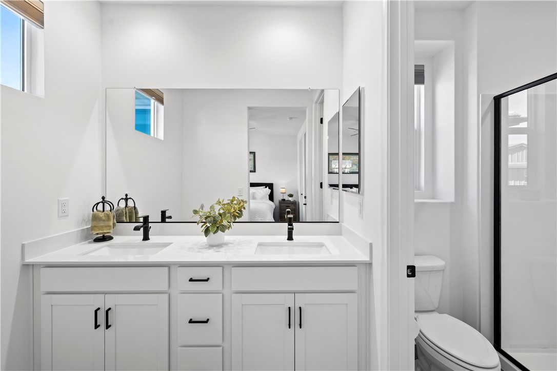821 Cornelia Way Rancho Mission Viejo, CA 92694 - Photo 13 of 61 a bathroom with a sink and a mirror