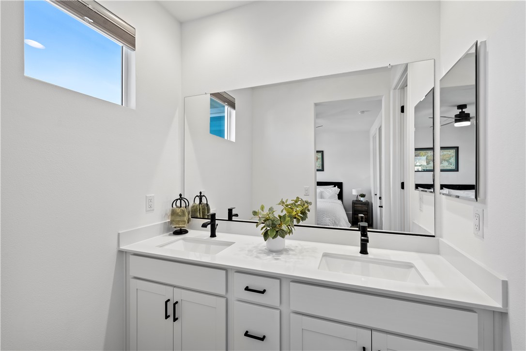 821 Cornelia Way Rancho Mission Viejo, CA 92694 - Photo 14 of 61 a bathroom with a sink and a mirror