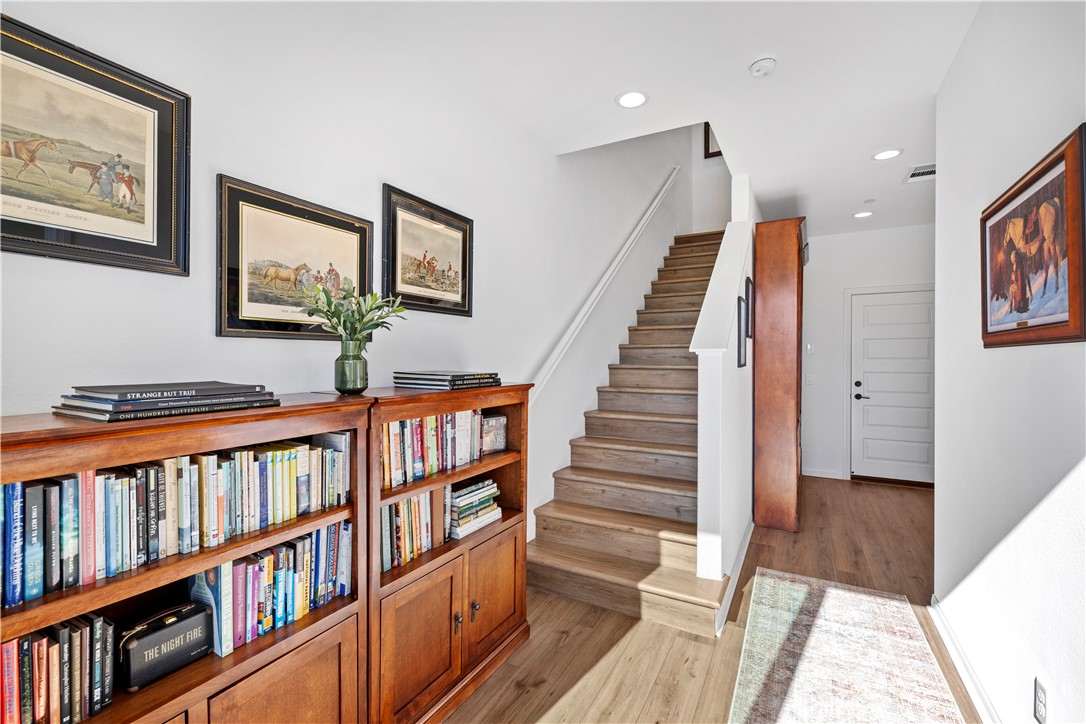 821 Cornelia Way Rancho Mission Viejo, CA 92694 - Photo 19 of 61 a view of a hallway with wooden floor and entryway