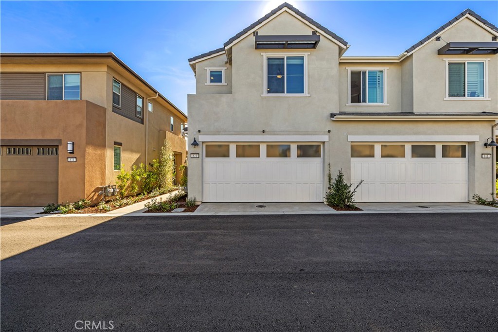 821 Cornelia Way Rancho Mission Viejo, CA 92694 - Photo 26 of 61 a front view of a house with a road