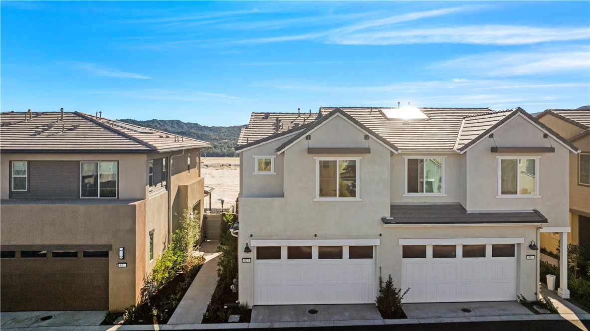 821 Cornelia Way Rancho Mission Viejo, CA 92694 - Photo 27 of 61 a front view of a house with a yard