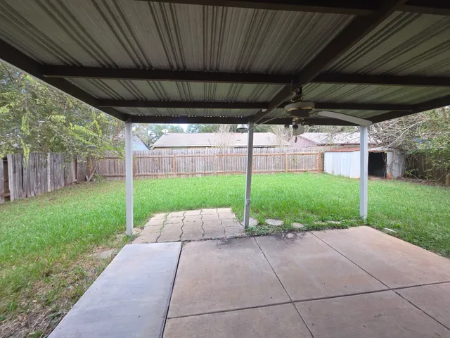 a view of a backyard with plants and garden
