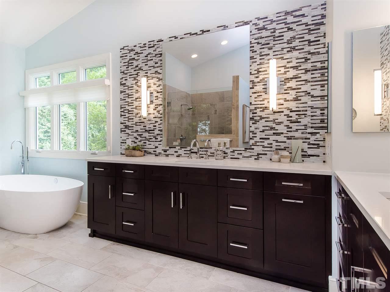 509 Lake Boone Trail Raleigh, NC 27608 - Photo 14 of 25 a bathroom with a bathtub sink and mirror