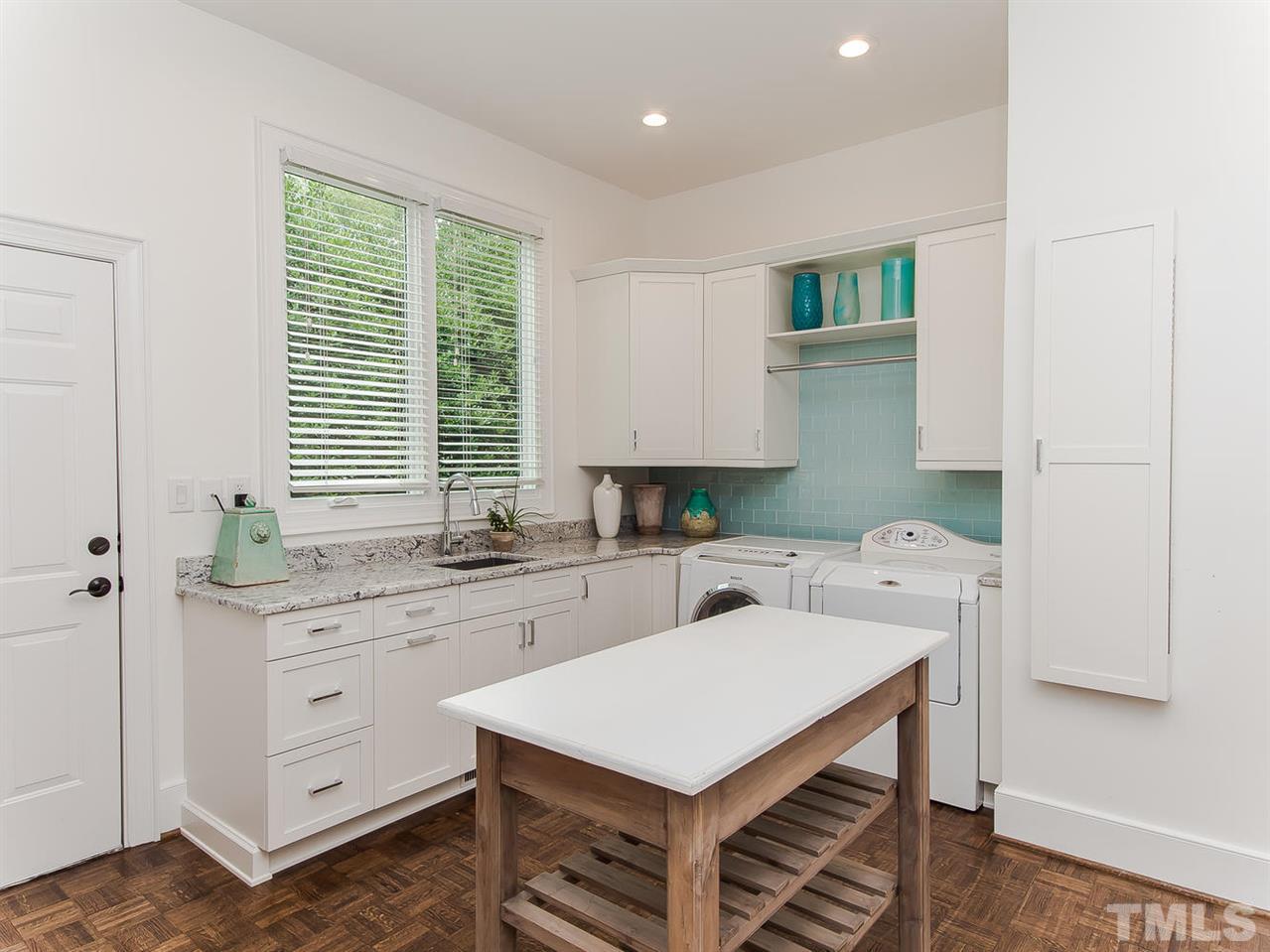 509 Lake Boone Trail Raleigh, NC 27608 - Photo 20 of 25 a kitchen that has a sink a stove and a refrigerator