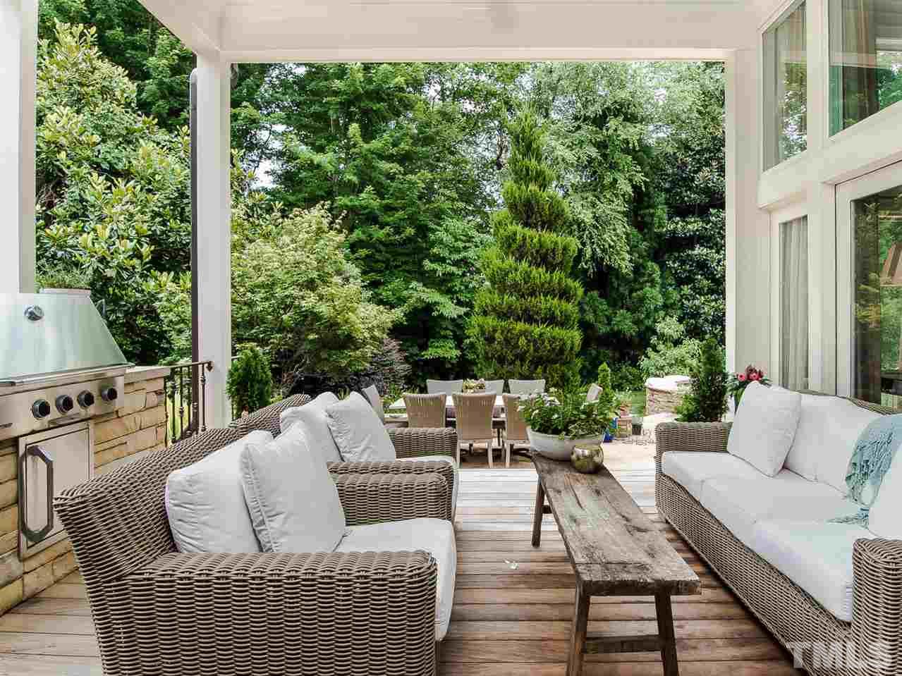 509 Lake Boone Trail Raleigh, NC 27608 - Photo 22 of 25 a view of a patio with couches chairs and potted plants