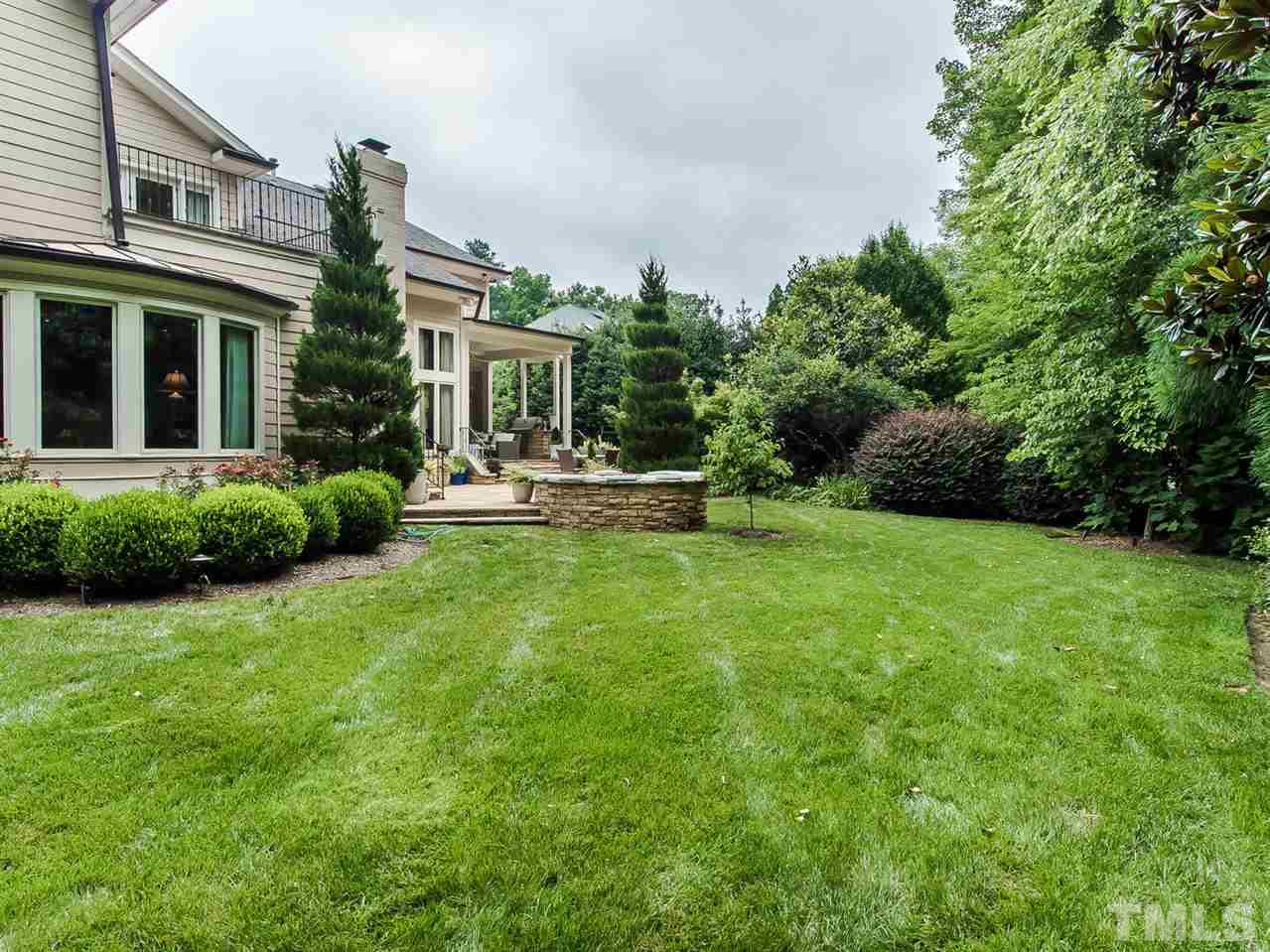 509 Lake Boone Trail Raleigh, NC 27608 - Photo 24 of 25 a view of a house with a backyard and a patio