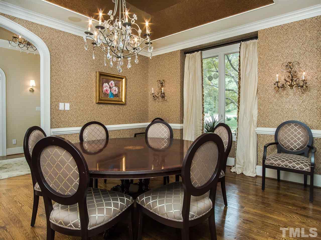 509 Lake Boone Trail Raleigh, NC 27608 - Photo 4 of 25 a view of a livingroom with furniture and a chandelier