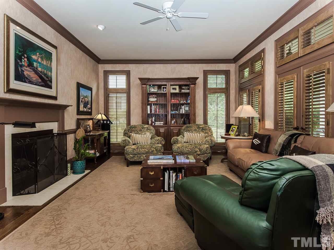 509 Lake Boone Trail Raleigh, NC 27608 - Photo 5 of 25 a living room with furniture large window and flat screen tv