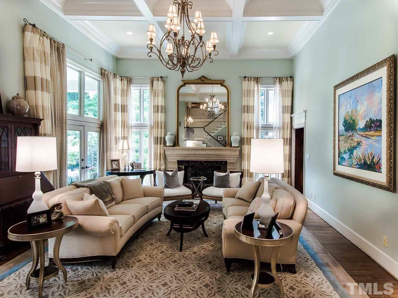 509 Lake Boone Trail Raleigh, NC 27608 - Photo 9 of 25 a living room with furniture chandelier and a fireplace