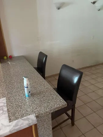 a workspace room with furniture