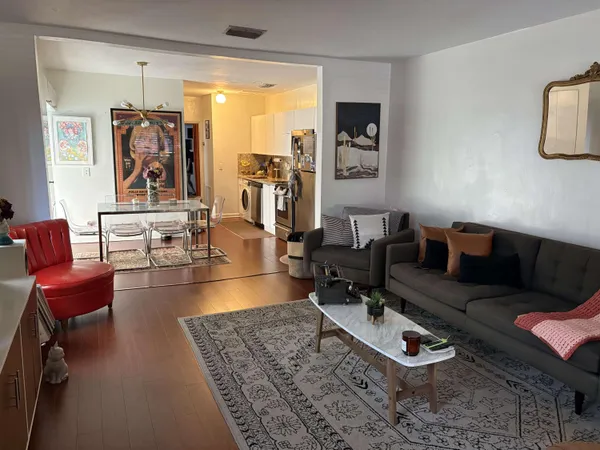 a bathroom with a sink a toilet a shower and a mirror