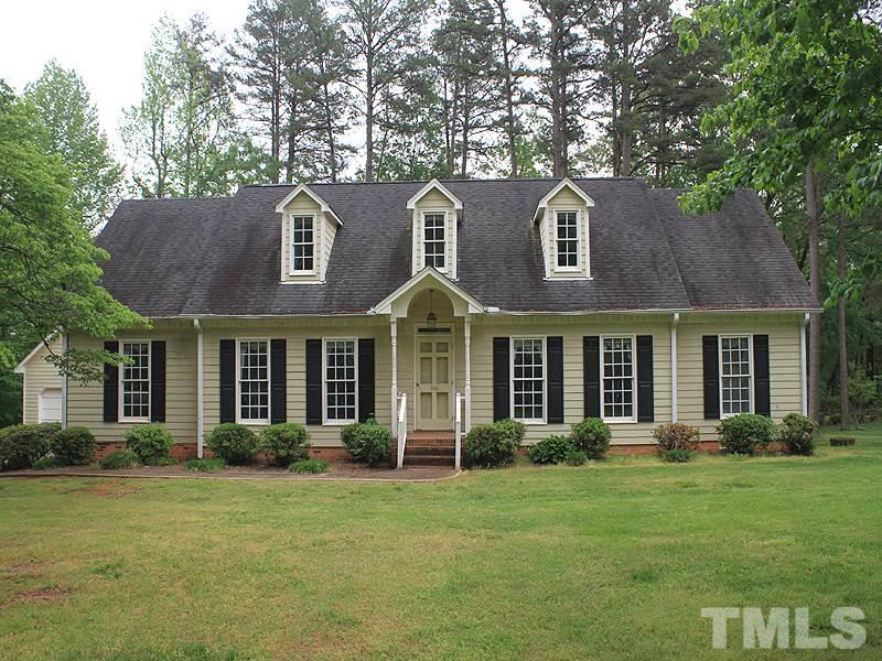 103 Calms Way Rougemont, NC 27572 - Photo 1 of 13 a front view of a house with garden