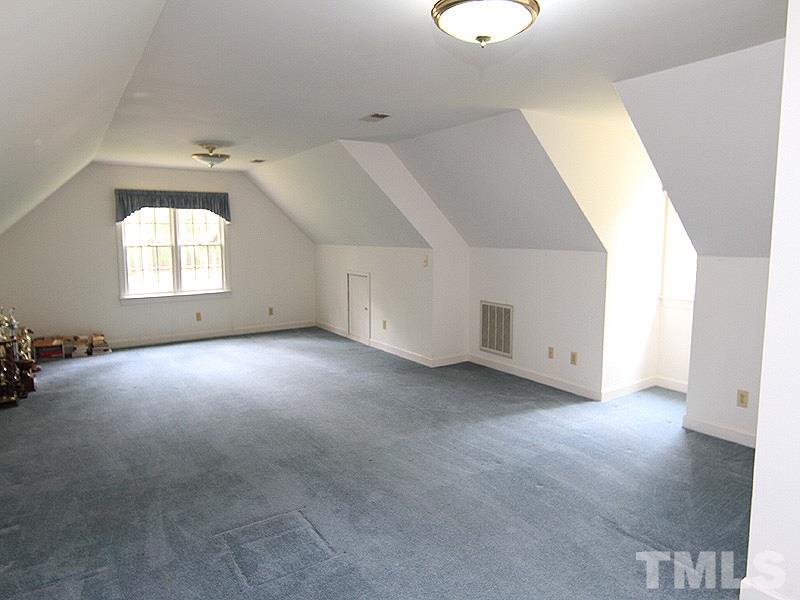 103 Calms Way Rougemont, NC 27572 - Photo 11 of 13 an empty room with windows and cabinet