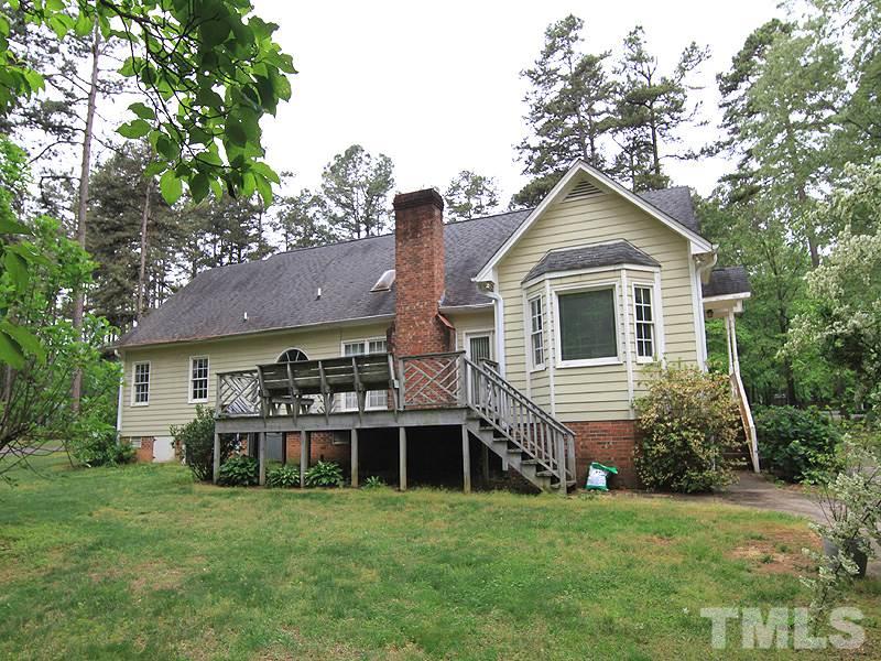 103 Calms Way Rougemont, NC 27572 - Photo 13 of 13 a front view of a house with a garden