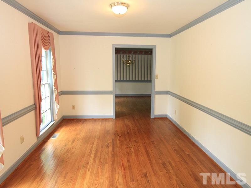 103 Calms Way Rougemont, NC 27572 - Photo 3 of 13 a view of empty room with wooden floor and fan