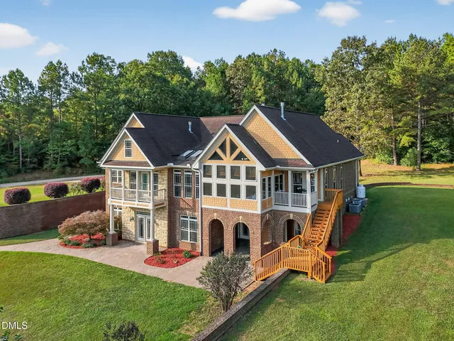 a aerial view of a house with swimming pool yard and patio