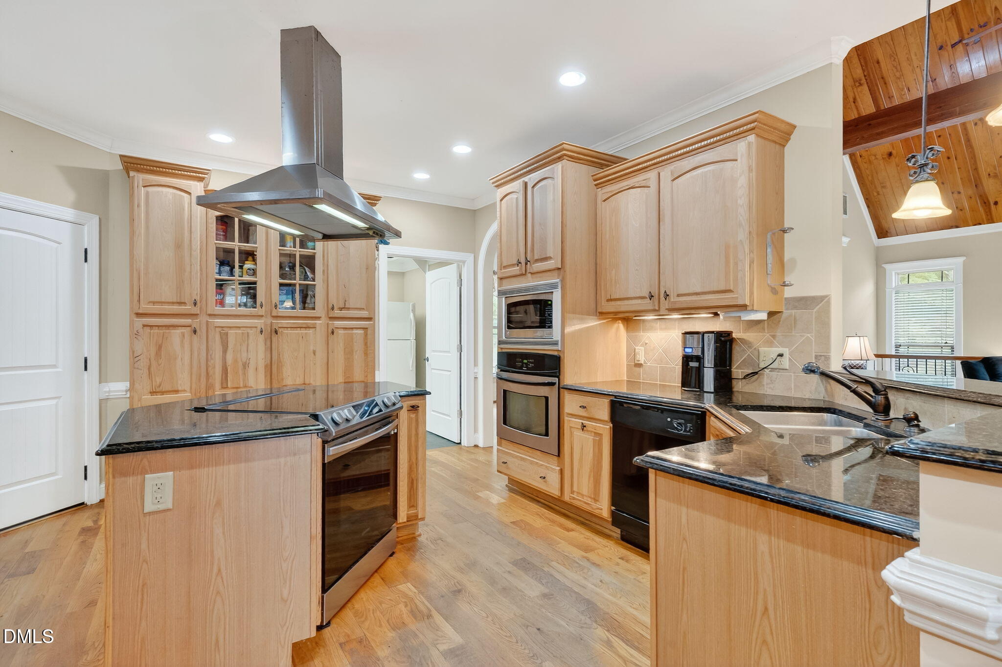 6570 Highway 231 Middlesex, NC 27557 - Photo 16 of 63 a kitchen with stainless steel appliances granite countertop a sink a stove and a refrigerator