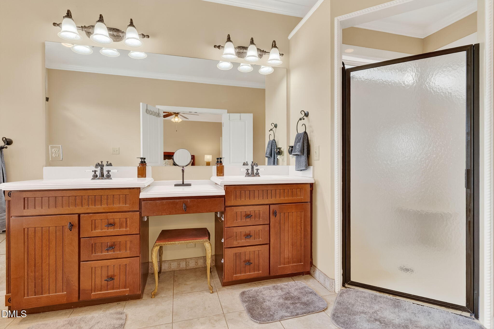 6570 Highway 231 Middlesex, NC 27557 - Photo 26 of 63 a bathroom with a sink vanity and mirror