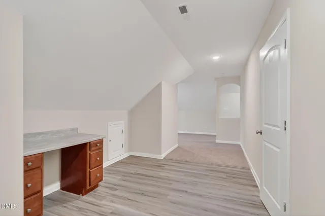 a kitchen with granite countertop cabinets stainless steel appliances and a sink