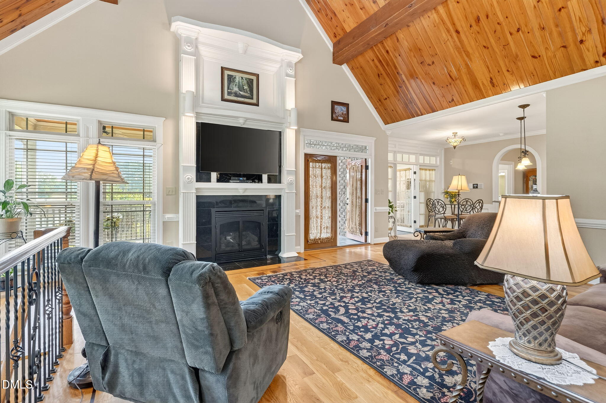 6570 Highway 231 Middlesex, NC 27557 - Photo 10 of 63 a living room with furniture a flat screen tv and a fireplace