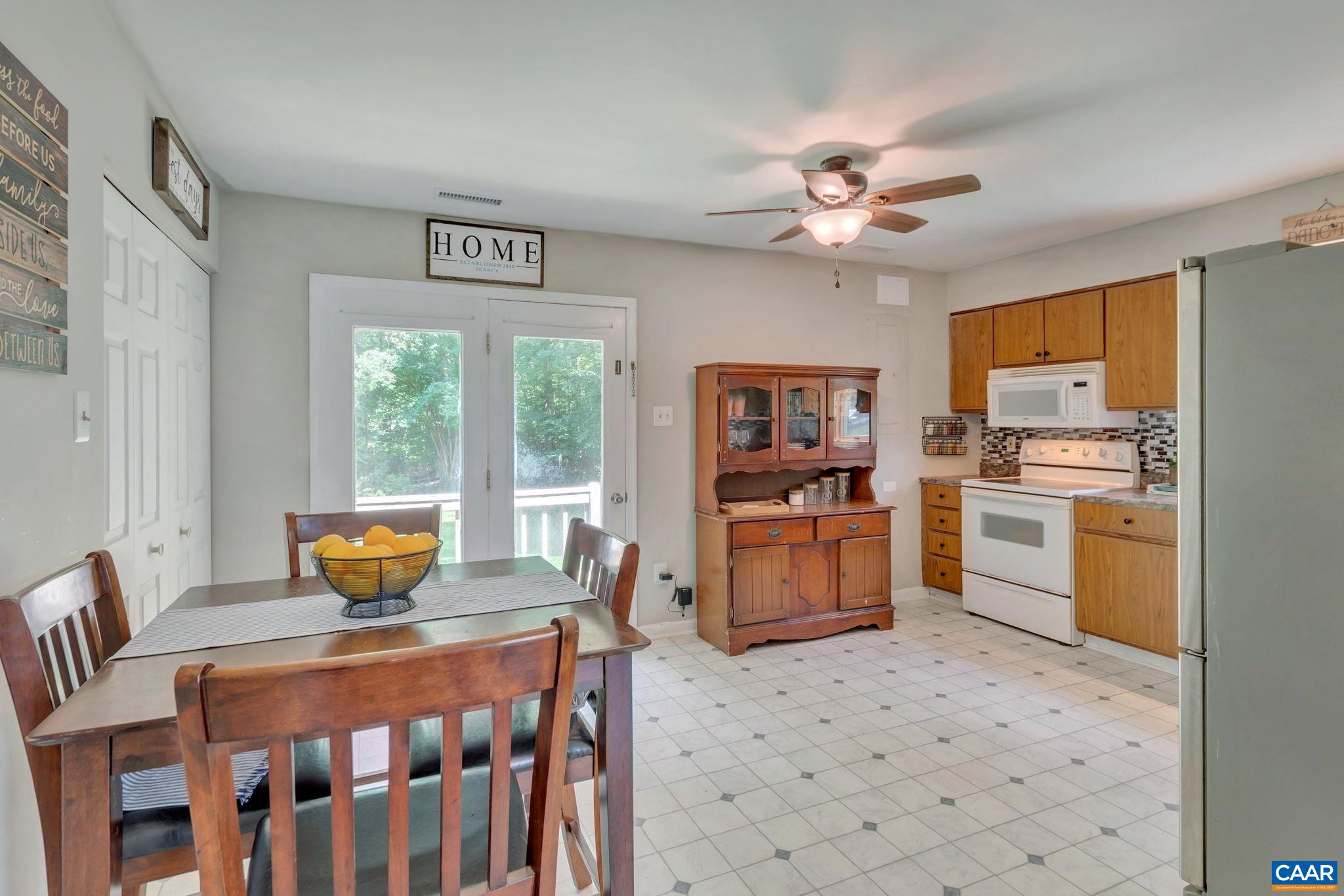 2597 Ridge Road Palmyra, VA 22963 - Photo 11 of 28 a kitchen with a stove a refrigerator and a stove top oven