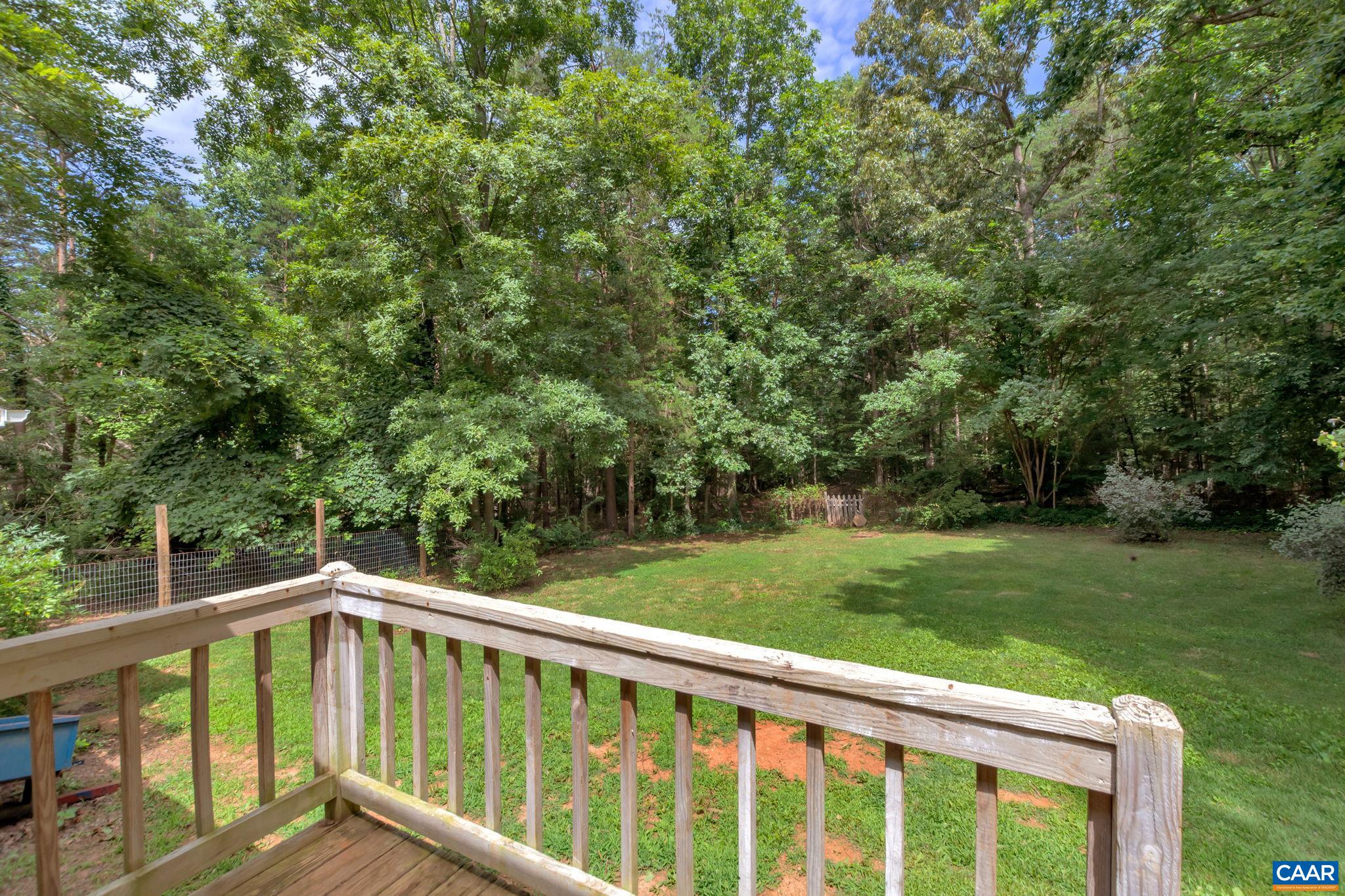 2597 Ridge Road Palmyra, VA 22963 - Photo 17 of 28 a view of a wooden deck with a yard