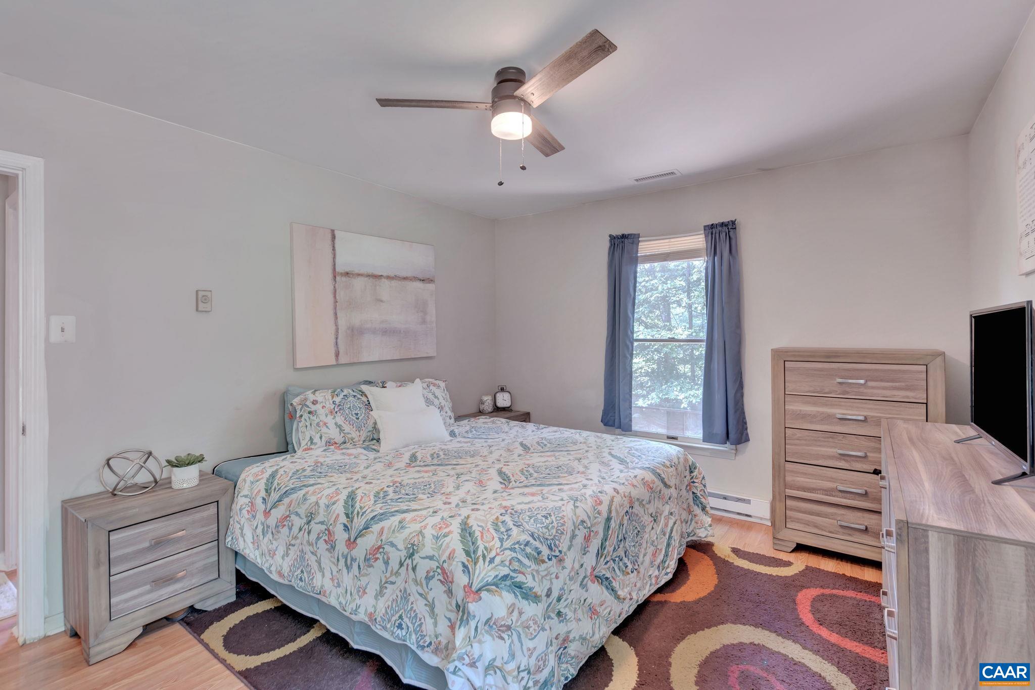 2597 Ridge Road Palmyra, VA 22963 - Photo 18 of 28 a bedroom with a large bed and a window