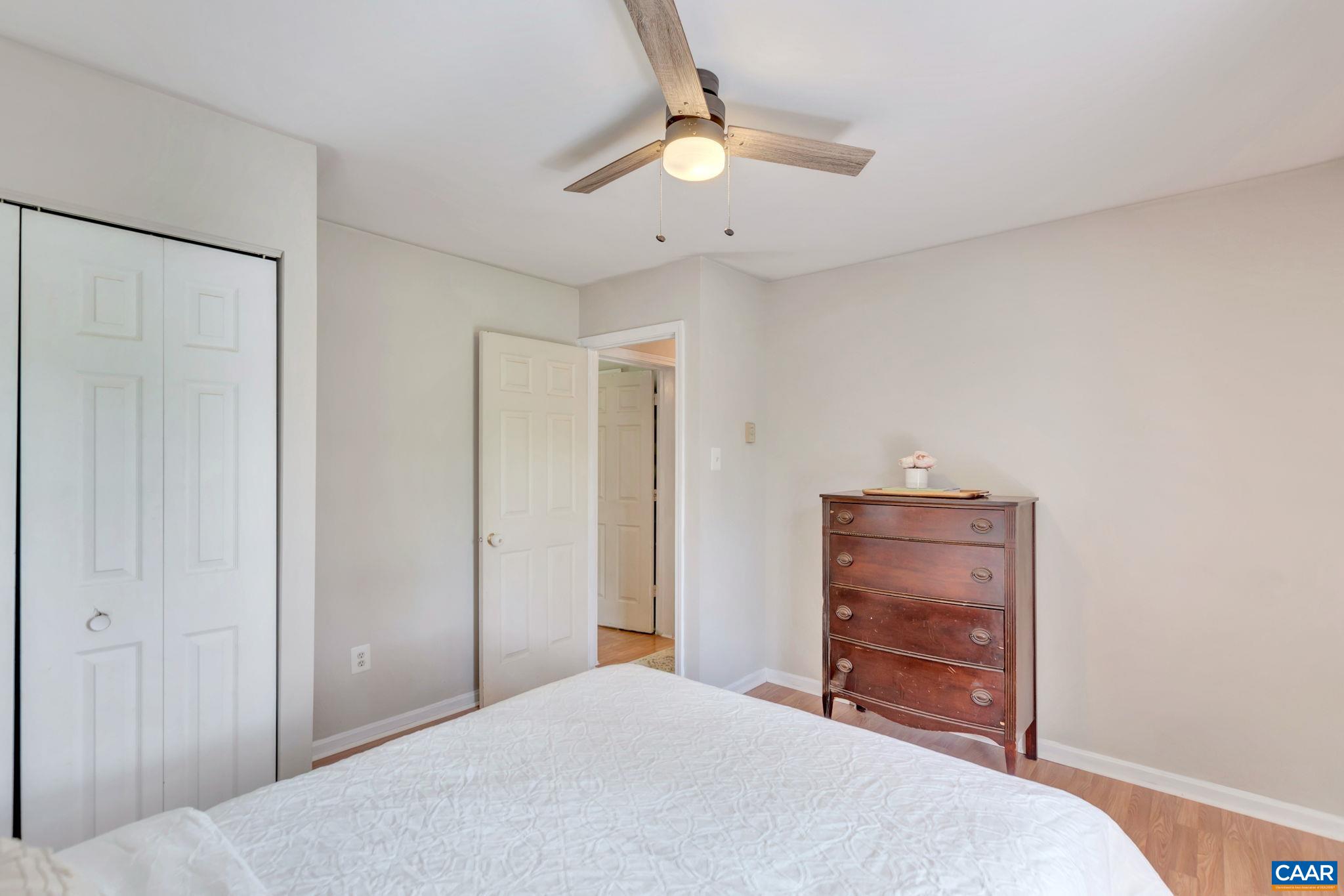 2597 Ridge Road Palmyra, VA 22963 - Photo 23 of 28 a bedroom with a bed and a chandelier