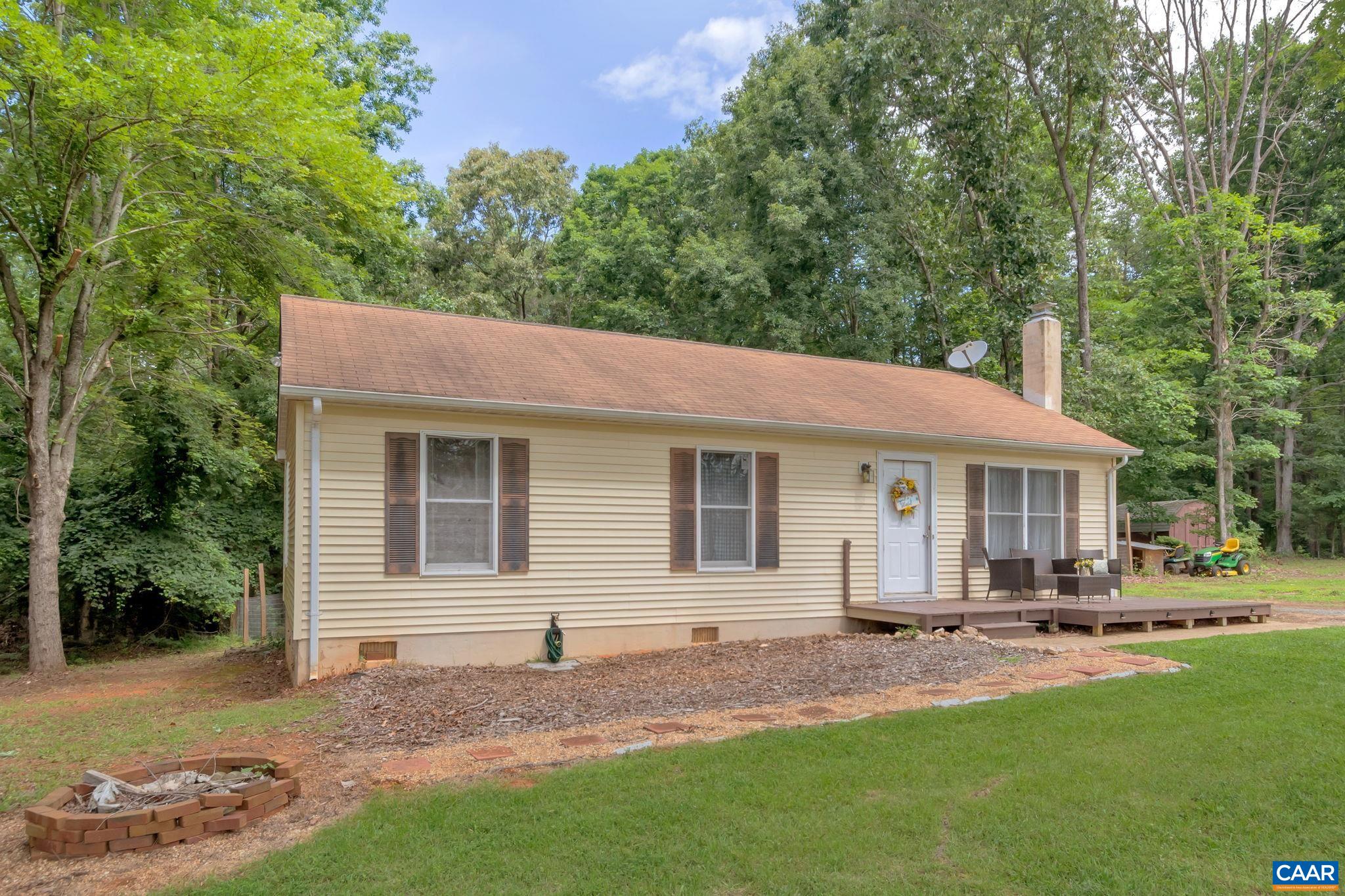 2597 Ridge Road Palmyra, VA 22963 - Photo 3 of 28 a backyard of a house with table and chairs