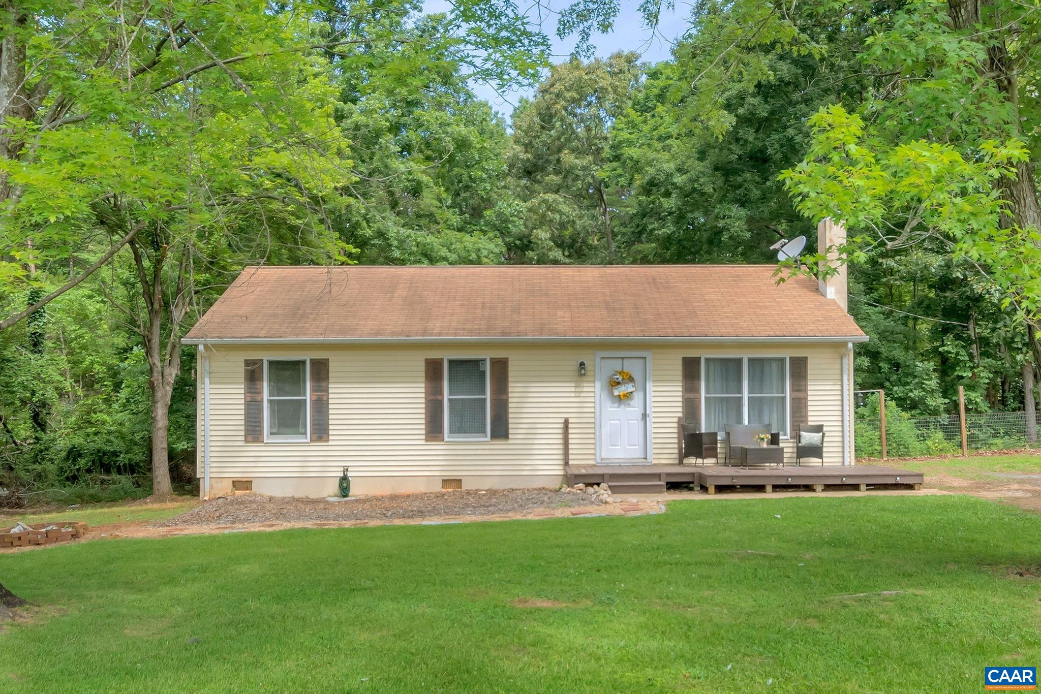 2597 Ridge Road Palmyra, VA 22963 - Photo 4 of 28 a backyard of a house with table and chairs