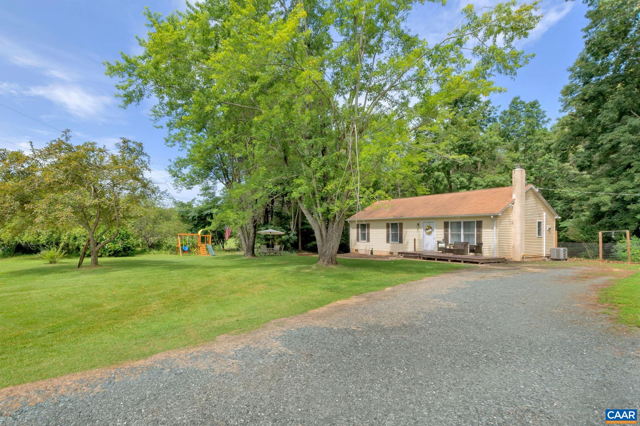 2597 Ridge Road Palmyra, VA 22963 - Photo 5 of 28 a front view of a house with a yard and pathway