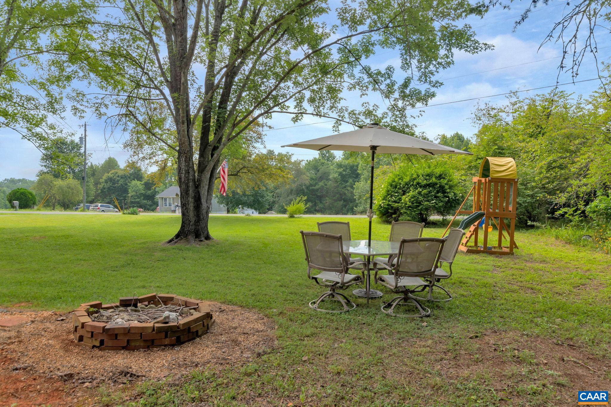 2597 Ridge Road Palmyra, VA 22963 - Photo 6 of 28 a view of a backyard with sitting area and garden