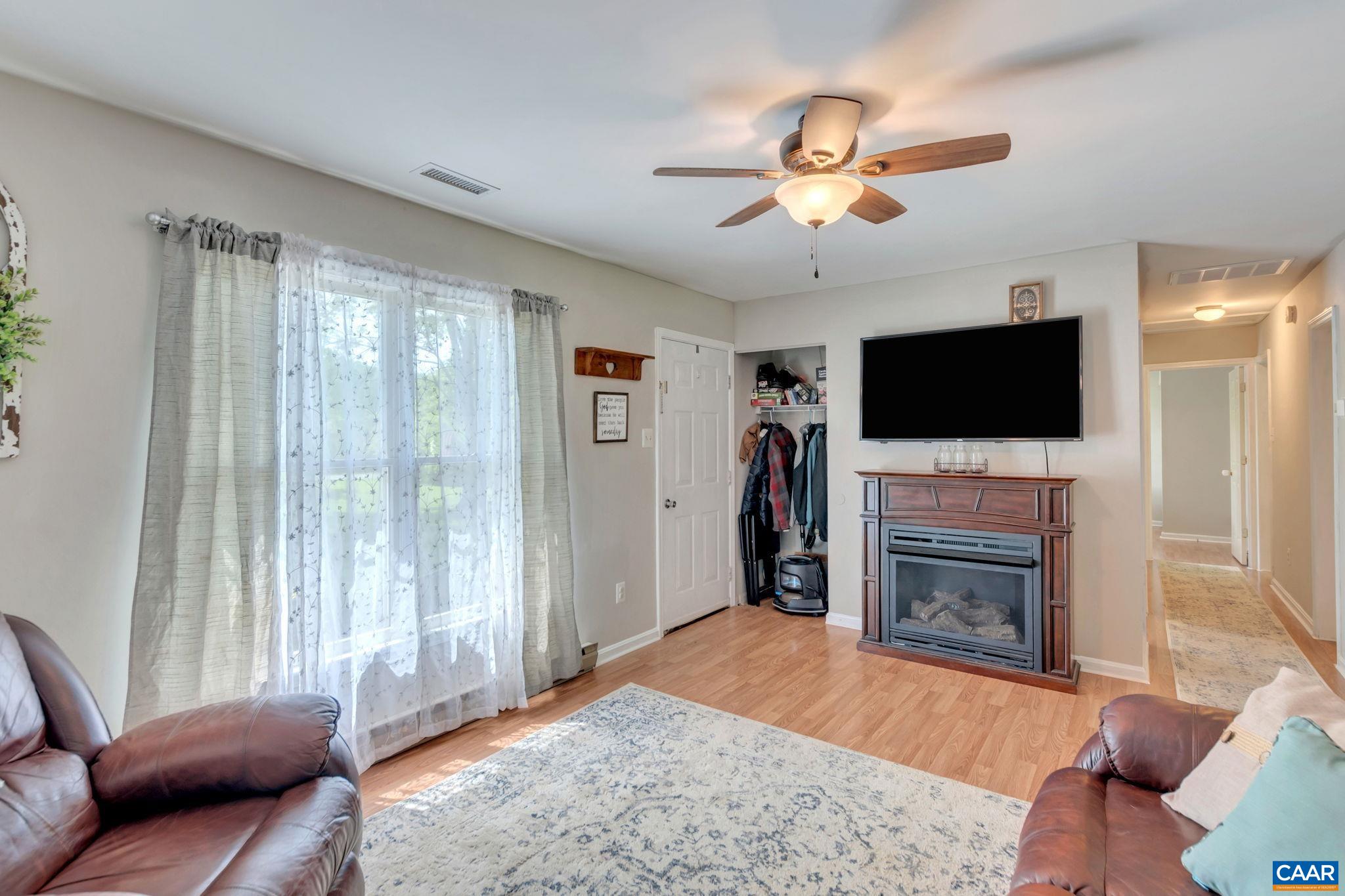2597 Ridge Road Palmyra, VA 22963 - Photo 10 of 28 a living room with furniture and a flat screen tv