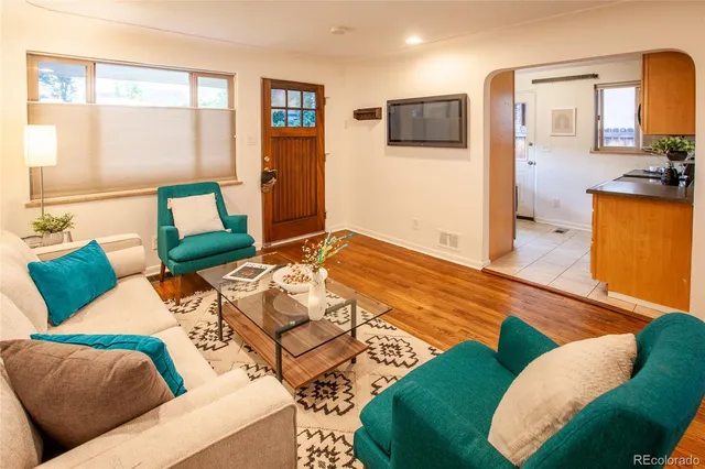 a bedroom with two beds and a television