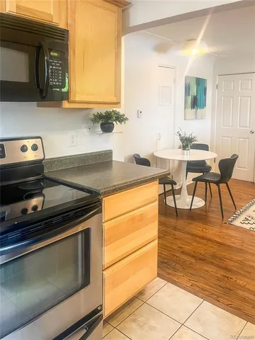 a kitchen with stainless steel appliances granite countertop a sink and cabinets