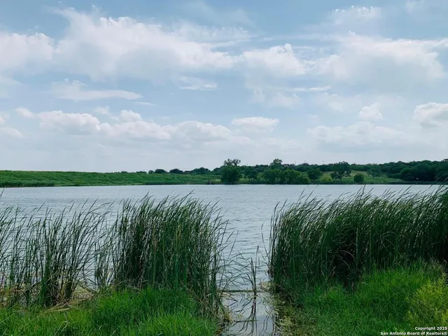 a view of lake with green space