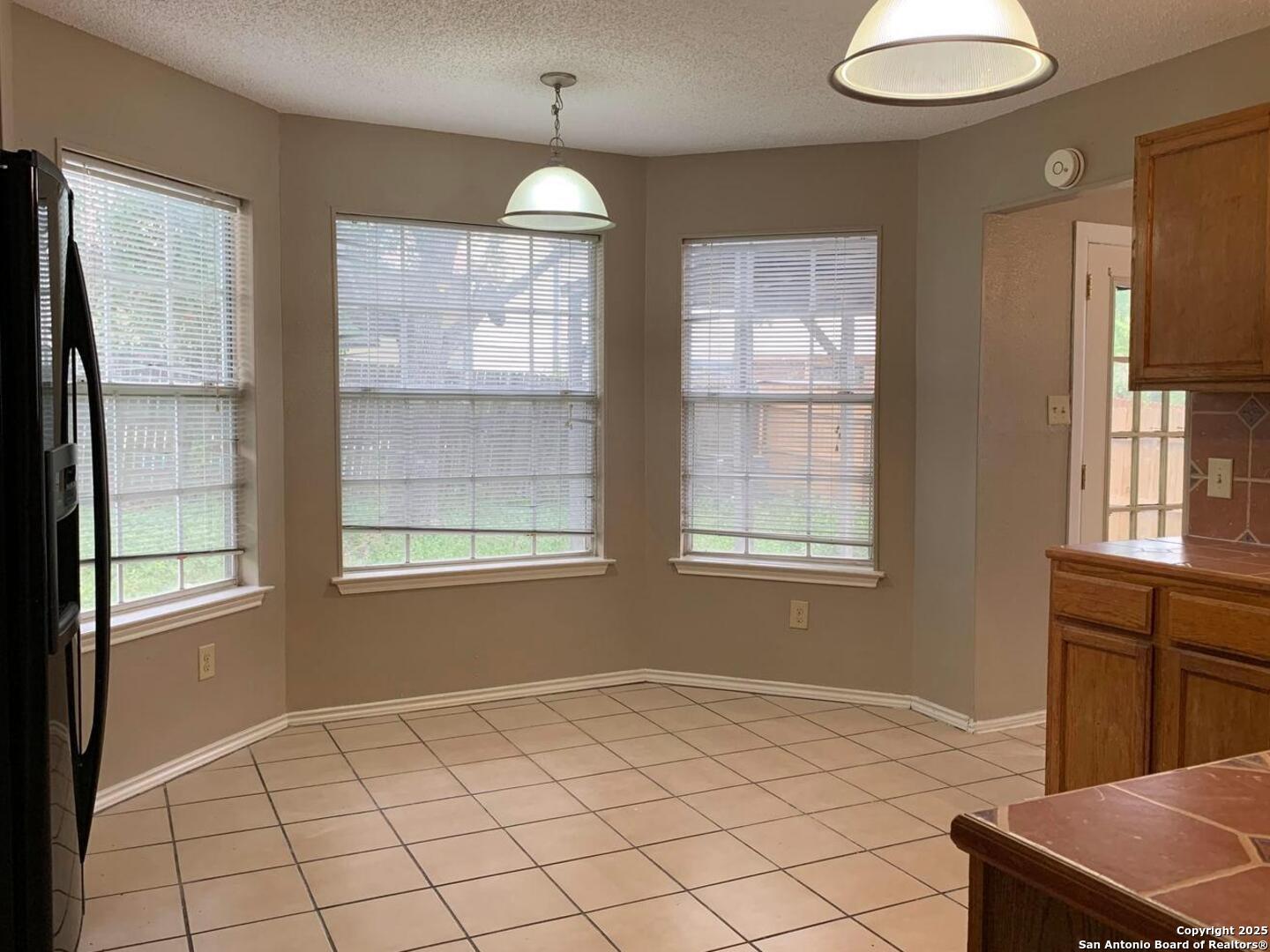 718 Meadow Top Converse, TX 78109 - Photo 8 of 15 a view of an empty room with a window