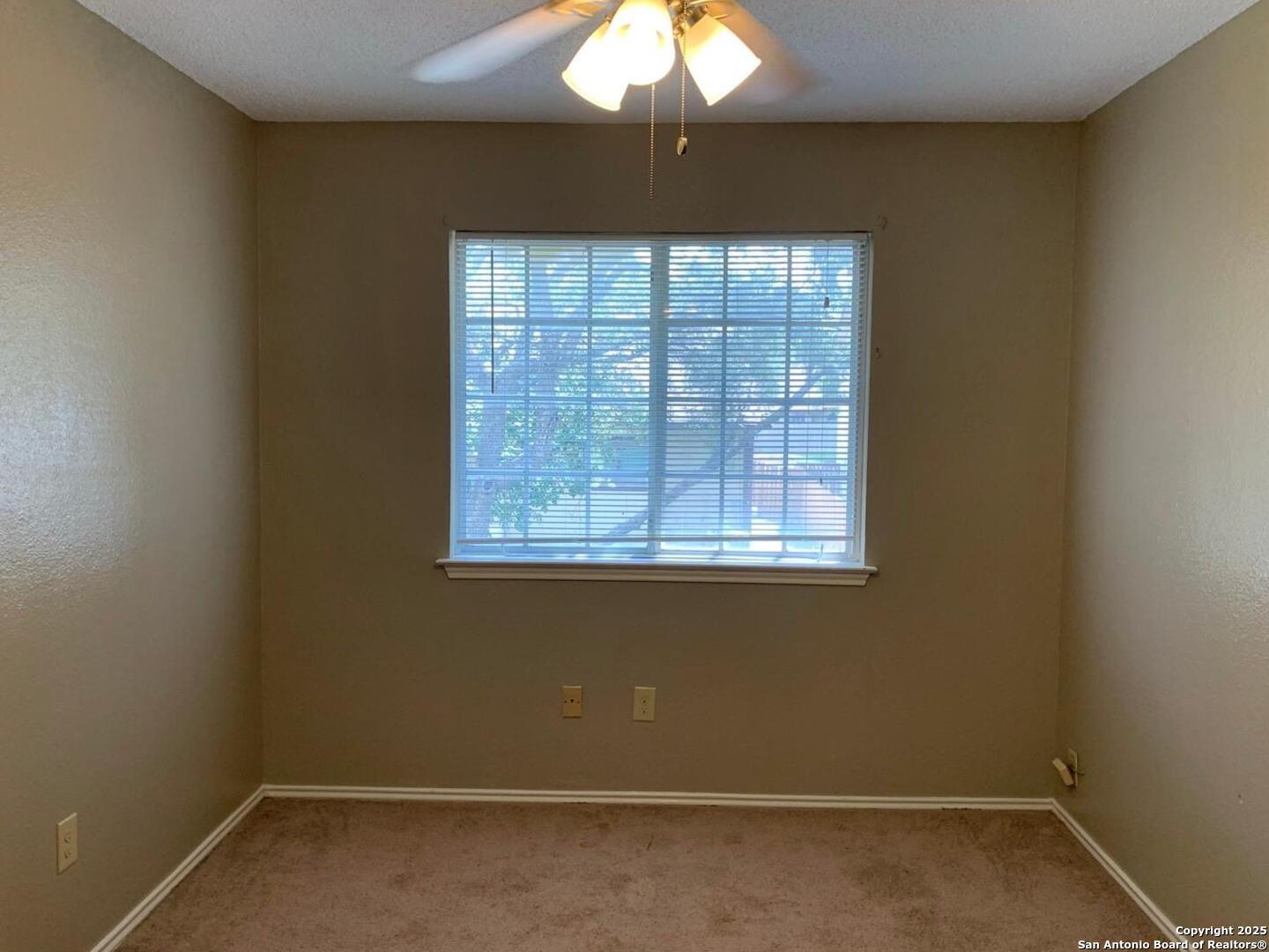 718 Meadow Top Converse, TX 78109 - Photo 9 of 15 an empty room with a window