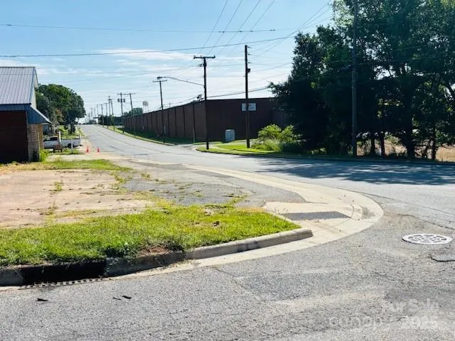 a view of a swimming pool with a yard
