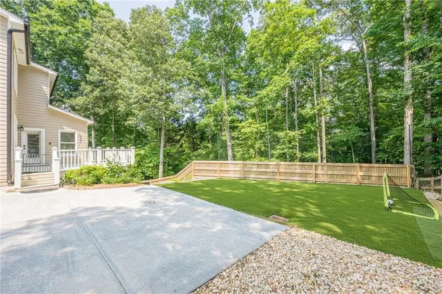 an aerial view of a house with a yard and garden