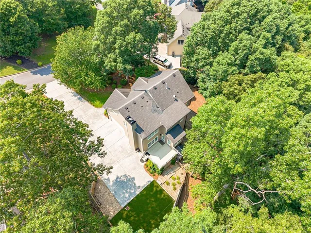 a view of a livingroom with wooden floor and a flat screen tv