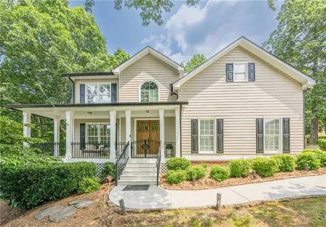 a view of a livingroom with furniture and a window