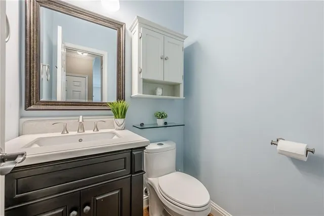 a spacious bedroom with a bed and a ceiling fan