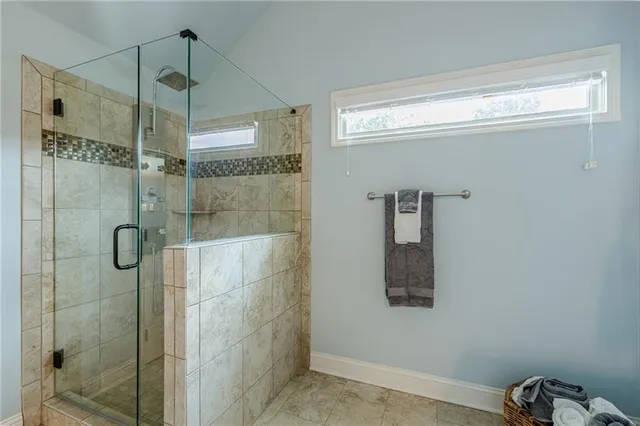 a bathroom with a toilet sink vanity and mirror